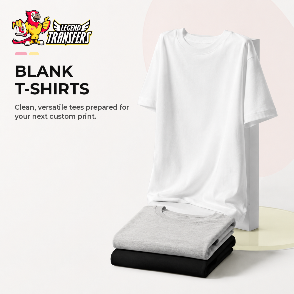 Plain blank t-shirts in black, white, gray, and beige hanging on wooden hangers.